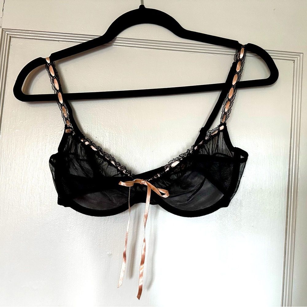 Sheer black bra with pink ribbon. 36C